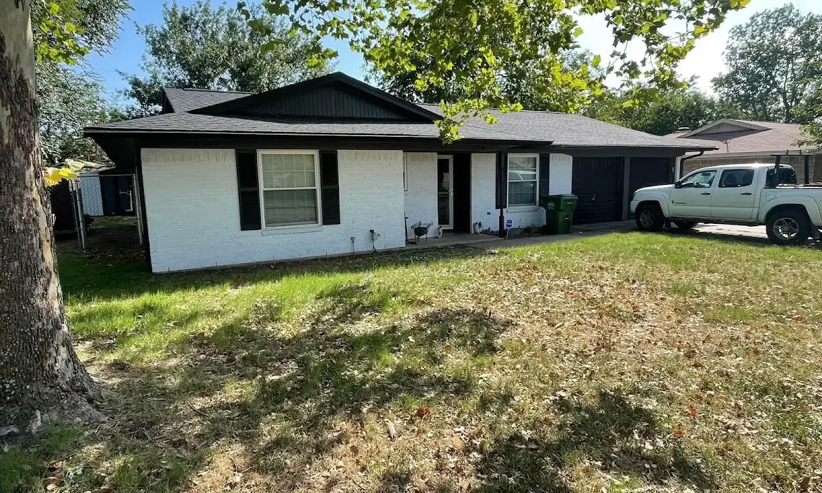 Professional roofing crew working on a residential roof in South Miami